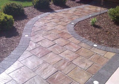 brick paver walkway with inserted lighting